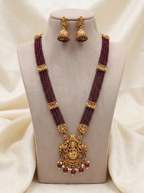 Ornate Lakshmi Crystal Bead Long Haram Set with Jhumkas - Maroon Beads - Necklace from Saubhagya Jewellery